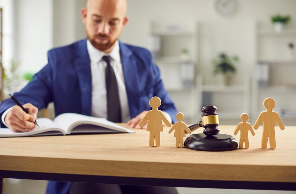 Judge gavel stands with family wooden figures
