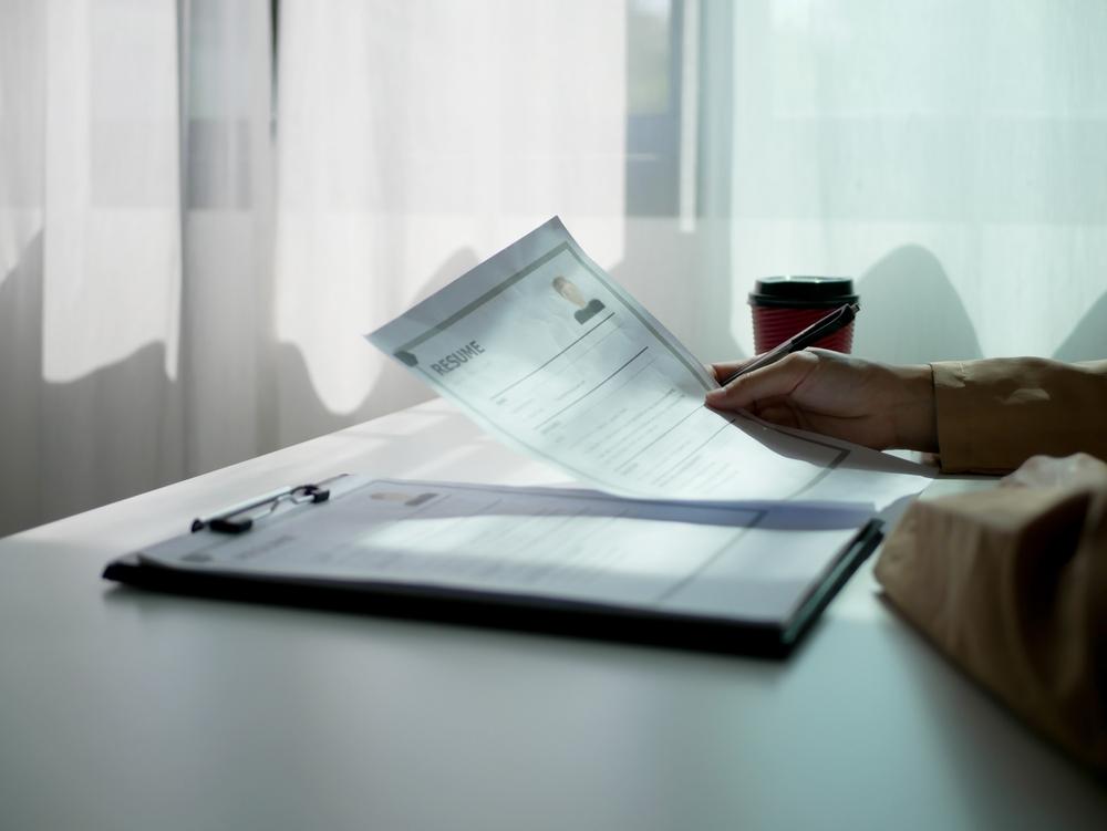 employer holding resume