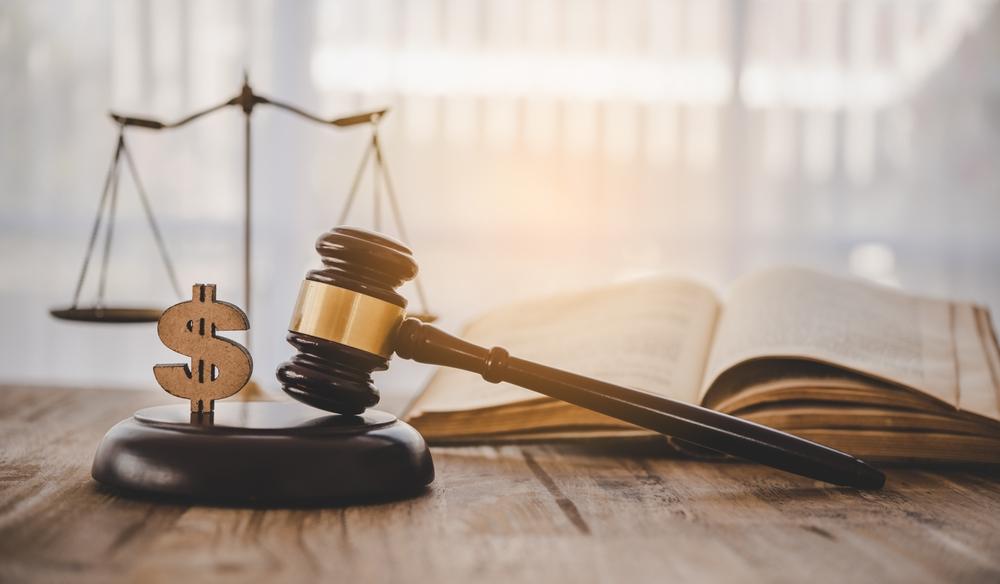 Judge hammer with the dollar placed