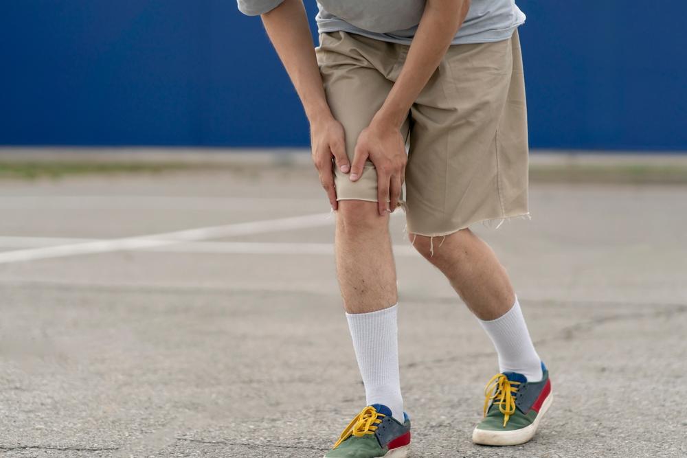 person walk in the street and fall down on the ground